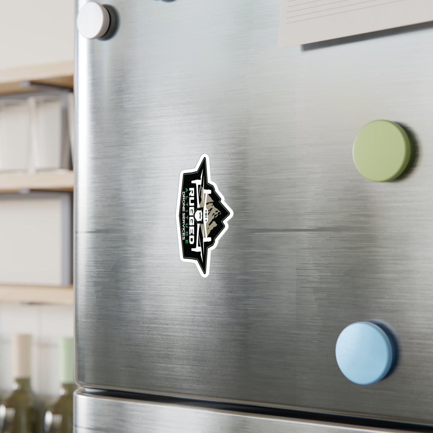 Drone service vinyl decals sticker on stainless steel refrigerator door among colorful fridge magnets