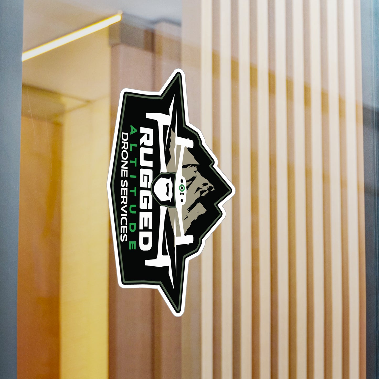 Printify drone service vinyl decals sticker on glass door featuring rugged mountain drone design
